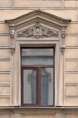 Fototapeta premium Windows in the city in the old style, with stucco, decorative elements