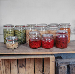 Fototapeta na wymiar Mason jars with fruits and vegetables in a cellar. Netherlands.
