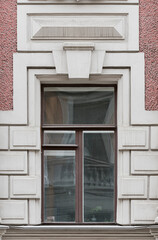 Windows in the city in the old style, with stucco, decorative elements