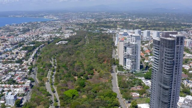Aerial forward over Avenida Anacaona and coast, Santo Domingo city