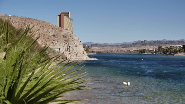 Riverfront of Colorado river, Laughlin, Nevada, USA, slow motion revealing view on sunny day