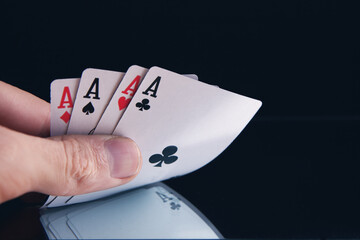 Obraz premium Winning poker hand of four aces playing cards