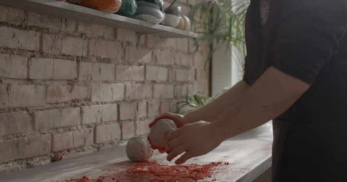 Ceramist mixes dye for kneading colored clay, nerikomi pottery, potter's workshop, 4k 60p Prores HQ 10 bit