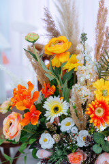 Composition of orange and yellow flowers. gerbera, roses and rose mix.