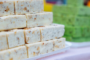 Fondant candy with nuts on the counter. Handmade healthy food without preservatives. Local production of desserts and sweets.