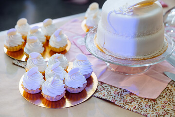  Cakes, cupcakes and cake on the table during the holiday and festival.