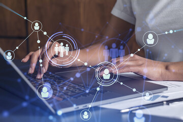 Hands of woman hr specialist is typing the keyboard in the internet to find the best candidates to...