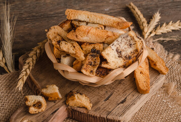 Appetizing fresh white bread croutons on wooden