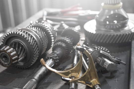 parts of an automotive manual transmission on a table in a car service. Close up