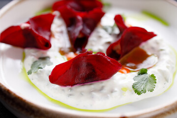 Beetroot ravioli stuffed with spinach and ricotta