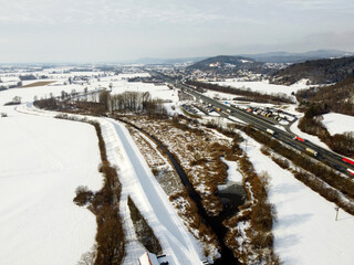 Obraz premium Aerial shots of a country road in Bavaria in winter