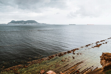 Gibraltar rock and sea view panorama from Centennial Park, Algeciras. Sea landscape with impressive ships traveling through the Bay of Algeciras, Andalusia, Southern Spain.