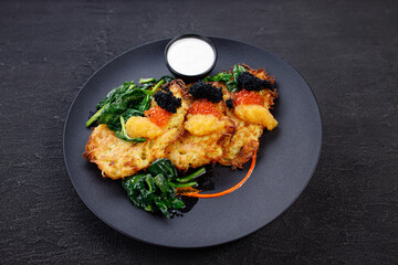 Hash brown potato, vegetable pancakes with caviar