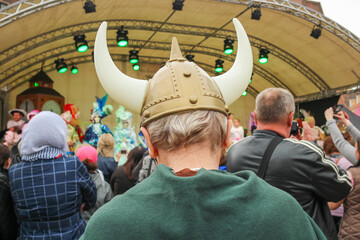 man in a viking costume and a helmet with horns at the carnival