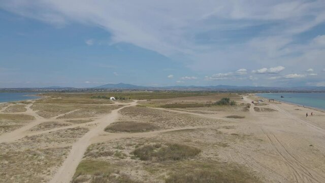 4k taking off clip over a peninsula on  the tropical beach of Epanomi, Halkidiki, Greece