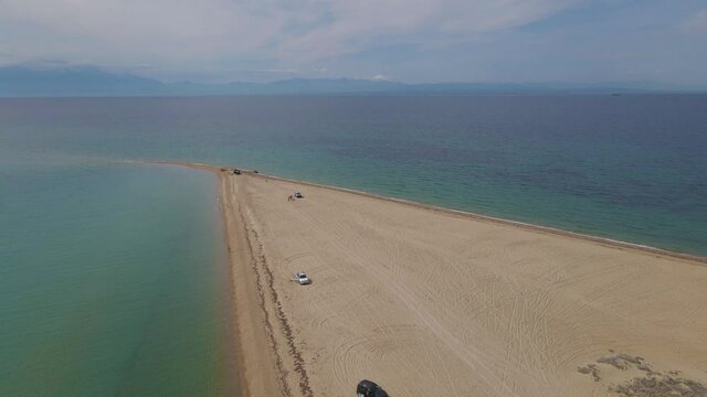4k steady clip over a peninsula on  the tropical beach of Epanomi, Halkidiki, Greece