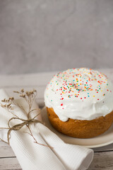 easter cake with icing and sprinkles on the table. Blank space for text
