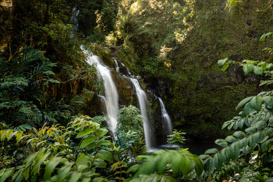 Water cascades down the three falls of the Waikani Falls along the road to Hana, Maui, Hawaii
