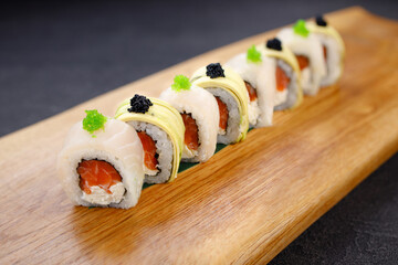 Seafood delicatessen sushi rolls set on board