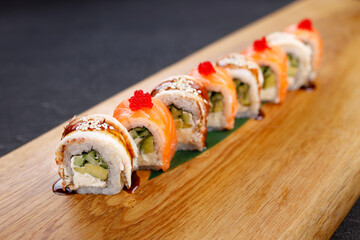 Seafood delicatessen sushi rolls set on board