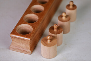 montessori sensorics cylinder block low to high and color blue box with cylinders