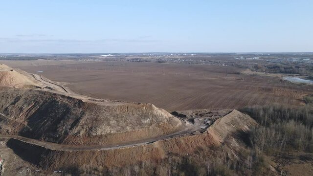 Flight over the landfill of household waste. Mothballed city dump.