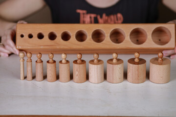 montessori sensorics cylinder block low to high and color blue box with cylinders