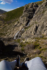 Long exposure of a high waterfall in the middle of the mountain from a spring in Madrid, Spain. Cascade of the litueros.