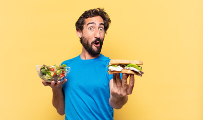 young crazy bearded athlete surprised expression and diet concept
