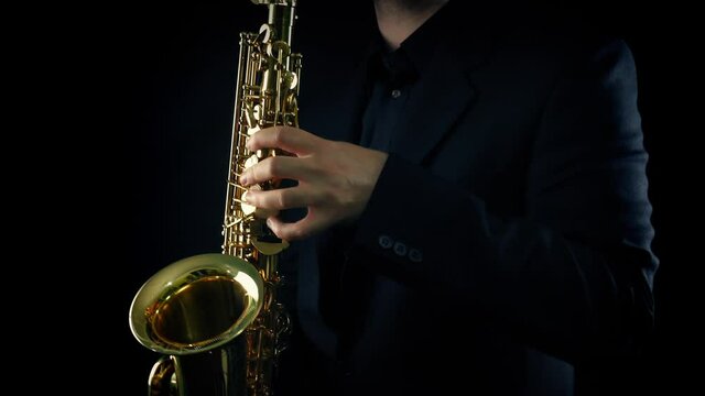Man Plays The Saxophone On Stage
