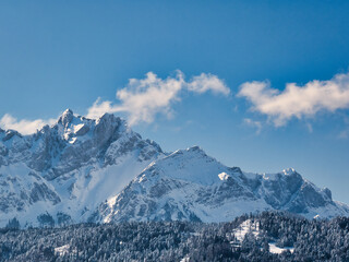Fototapeta na wymiar Side view of snow covered Mount Pilatus, blue sky with few clouds