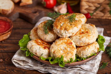 Chicken cutlets from minced meat with dill. Pan-fried meatballs. Healthy dinner for the family. Rustic style