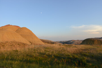 Landscape view of the unusual rock formations at Badlands National Park in South Dakota at sunset