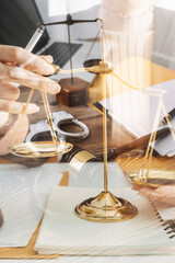 justice and law concept.Male judge in a courtroom on wooden table and Counselor or Male lawyer working in office. Legal law, advice and justice concept.