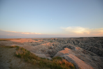 Landscape view of the unusual rock formations at Badlands National Park in South Dakota at sunset