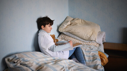 Poor sad small girl on bed indoors at home, poverty concept. - obrazy, fototapety, plakaty