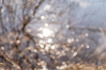 Blurred background glare on the water .