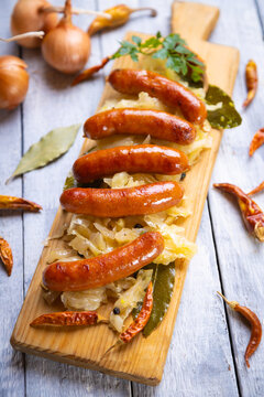 Grilled german sausage links with sauerkraut