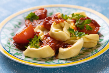 Italian tortellini pasta in tomato sauce