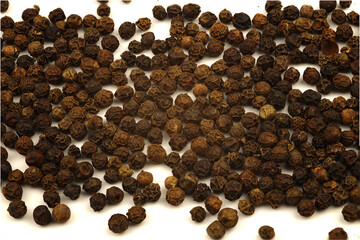 black pepper scattered on a white background, isolated