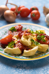 Italian tortellini pasta in tomato sauce