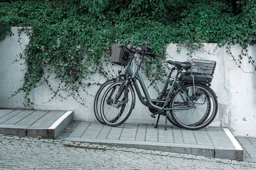 Fototapeta na wymiar Bicycles parked on the sidewalk in a german tourist location on Rugen island