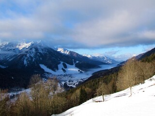 Fototapeta na wymiar Mountain peaks above the town of Kranjska gora and Vrsic pass in Gorenjska, Slovenia in winter