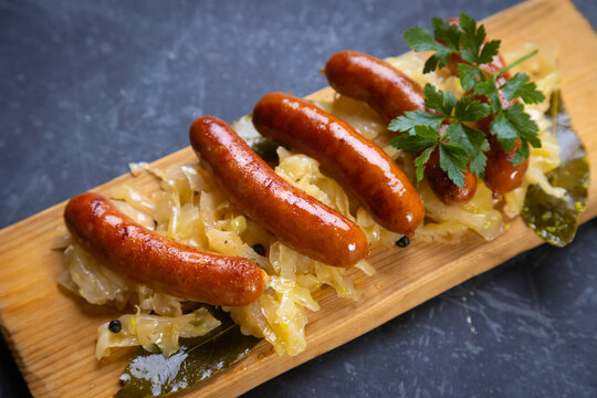 Grilled german sausage links with sauerkraut