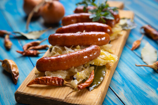 Grilled german sausage links with sauerkraut
