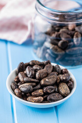 Roasted cocoa beans in bowl