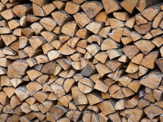 Stacked chopped firewood, natural wood texture