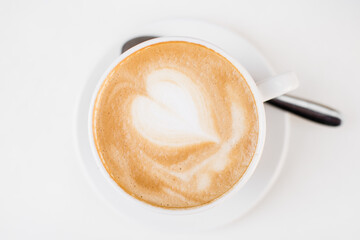 Cup of cappuccino with heart drawing