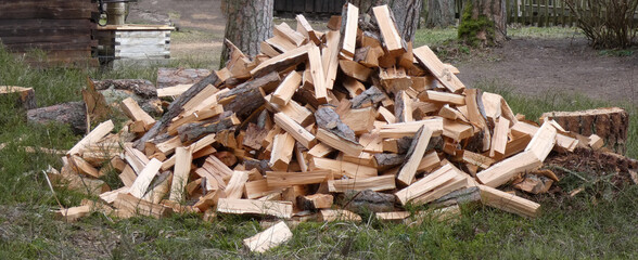 Freshly chopped pile of firewood, horizontal shot