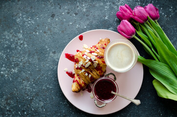 Breakfast with bouquet of pink tulips